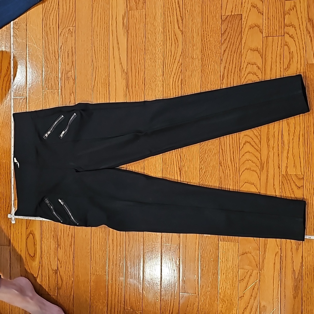 Black stretchy pants zipper details